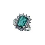 An emerald and diamond cluster ring,