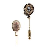 An enamelled mourning stick pin, together with a cameo stick pin,