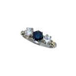 An early 20th century sapphire and diamond three stone ring,