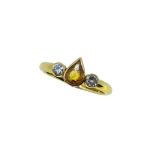 An 18ct gold yellow sapphire and diamond ring,