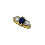 A sapphire and diamond carved half hoop ring,