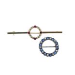 Two circular brooches,