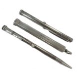 A trio of silver writing implements,