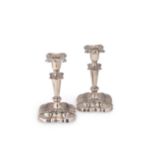 A pair of Edward VII silver library candlesticks,