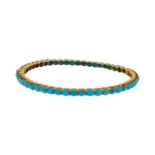 A turquoise bangle,