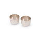 A pair of late 20th century silver tumbler cups,