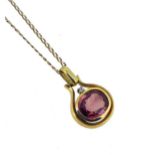 A pink tourmaline pendant and chain,