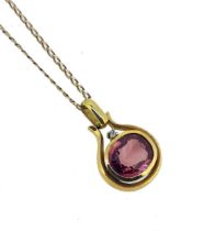 A pink tourmaline pendant and chain,