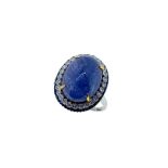 A modern tanzanite, diamond and sapphire ring,