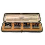 A cased set of early 20th century silver and tortoiseshell menu holders,