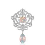 An opal and diamond pendant/brooch,