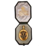 An enamelled memorial locket,