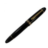 Montblanc - A Meisterstück resin cased fountain pen and accompanying inkwell,