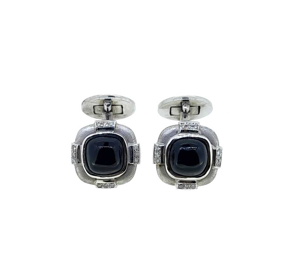 A pair of onyx and diamond cufflinks,