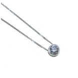 A modern single stone diamond pendant and chain,