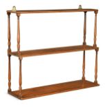 A set of Regency mahogany waterfall hanging shelves,