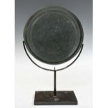 A Chinese bronze circular mirror, possibly Tang Dynasty,