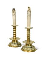 A pair of pressed brass candlestick lamps, 19th century,