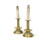 A pair of pressed brass candlestick lamps, 19th century,