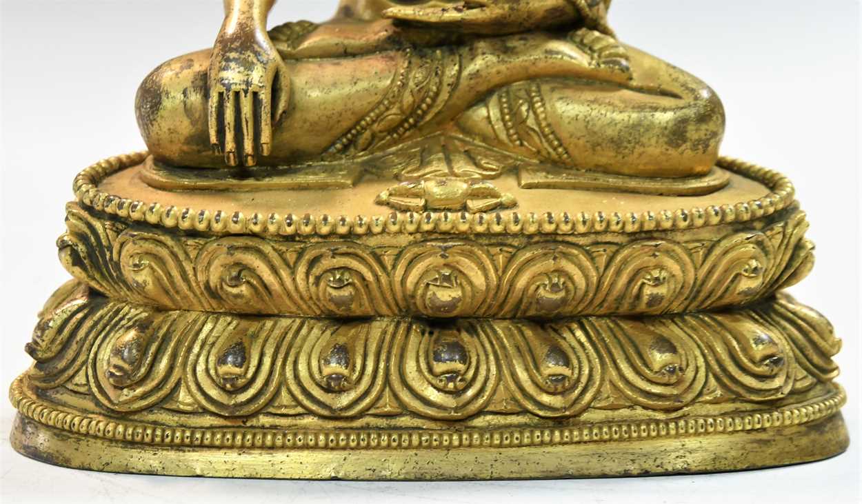 A Chinese gilt bronze figure of Buddha seated in meditation, - Image 4 of 13