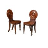 A pair of William IV mahogany hall chairs,