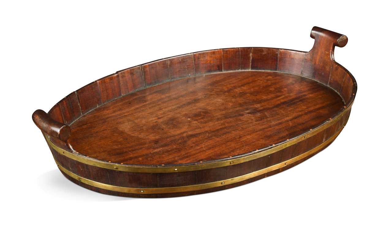 A George III mahogany and brass bound oval tray,