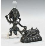 A Tibetan white metal figure of Yama Dharmaraja, 19th/20th century,
