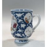 A Chinese export porcelain mug showing an acupuncturist, Qianlong, circa 1780,