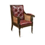 A caned mahogany bergere library armchair, 19th century,