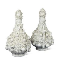 A pair of Meissen schneeballen bottle vases and covers,