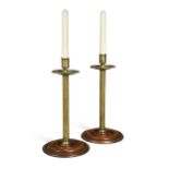A pair of George III mahogany and brass candlesticks,