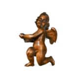 A carved limewood figure of winged Cupid, probably 19th century,