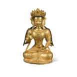 A Chinese gilt bronze figure of Maitreya,
