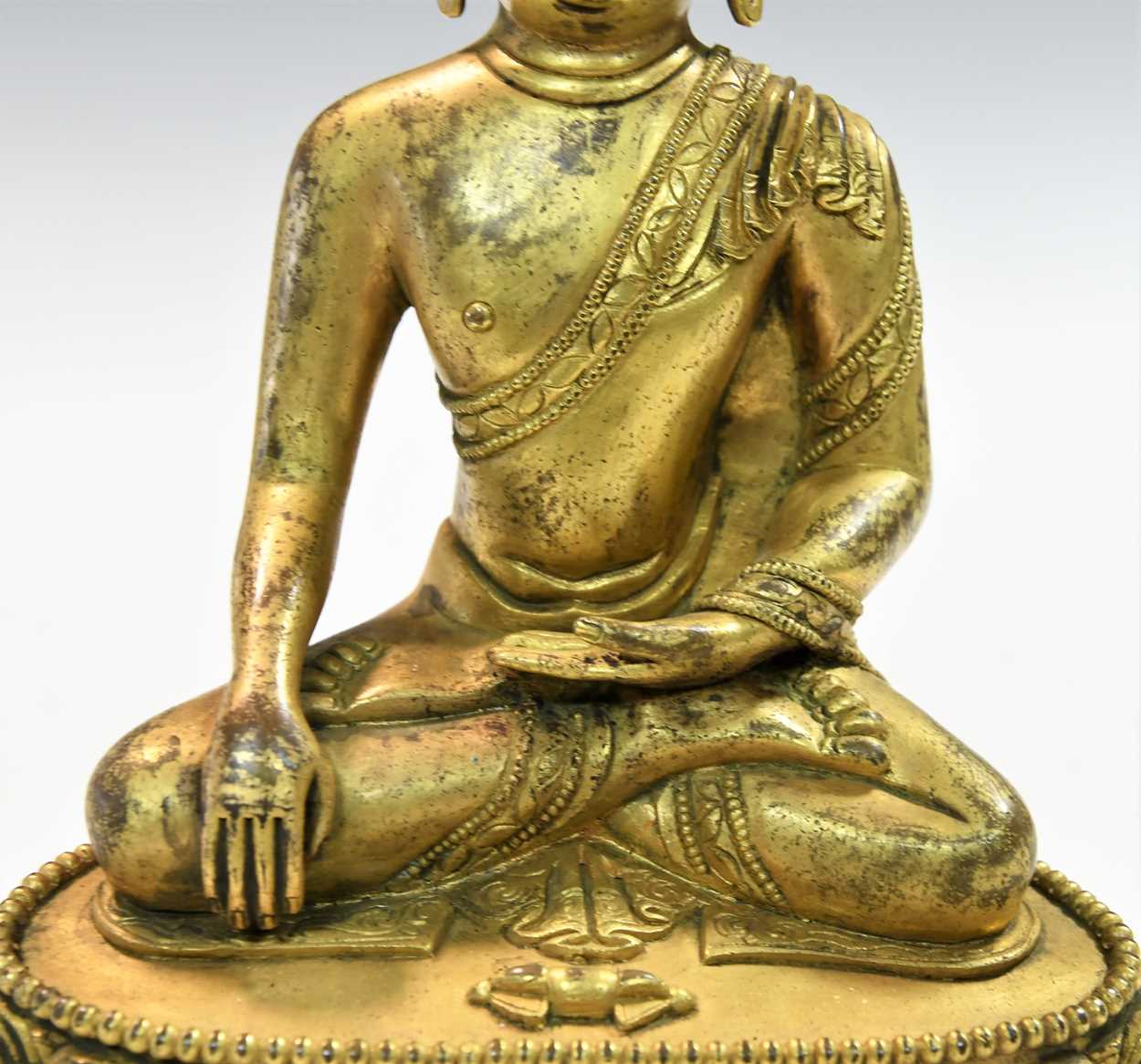 A Chinese gilt bronze figure of Buddha seated in meditation, - Image 3 of 13