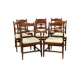 A set of eight Regency mahogany and brass line inlaid dining chairs,