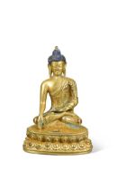 A Chinese gilt bronze small figure of the seated Buddha,