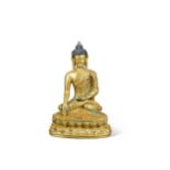 A Chinese gilt bronze small figure of the seated Buddha,