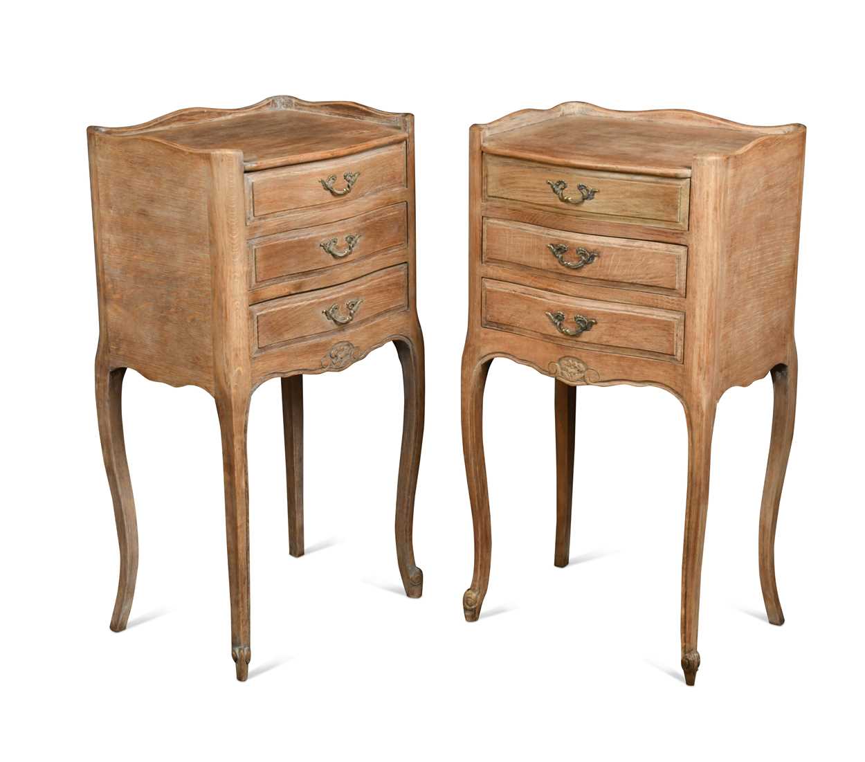 A pair of French provincial bleached oak bedside cabinets, 20th century,