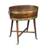 A George III brass bound mahogany wine cooler,