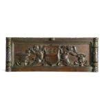 A Tudor carved oak coat of arms,