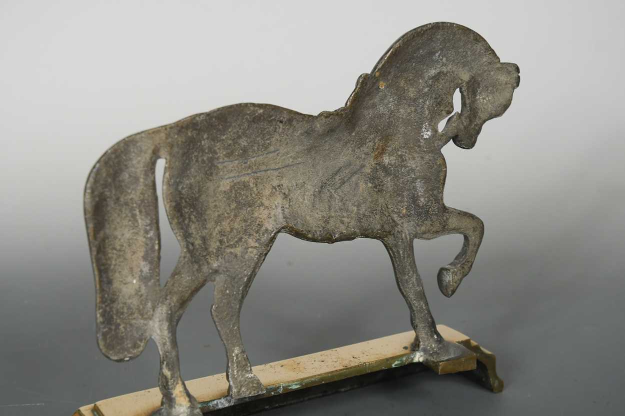 A polished pewter and brass doorstop, 19th century, - Image 3 of 4