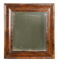 A walnut cushion framed mirror, 18th century,
