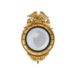 A carved giltwood convex wall mirror, 19th century,