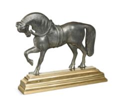 A polished pewter and brass doorstop, 19th century,