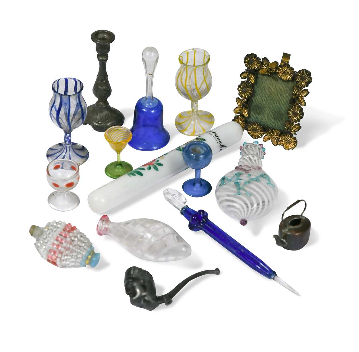 A collection of miniature blown glass wine glasses,