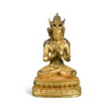 A Chinese gilt bronze figure of a crowned Buddhist god,