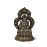 A Tibetan white metal seated Buddha, 19th/20th century,