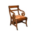 A mahogany metamorphic library armchair in the manner of Morgan and Sanders, 20th century,