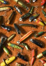 A good collection of vintage lures and pike plugs, mostly early to mid 20th century,