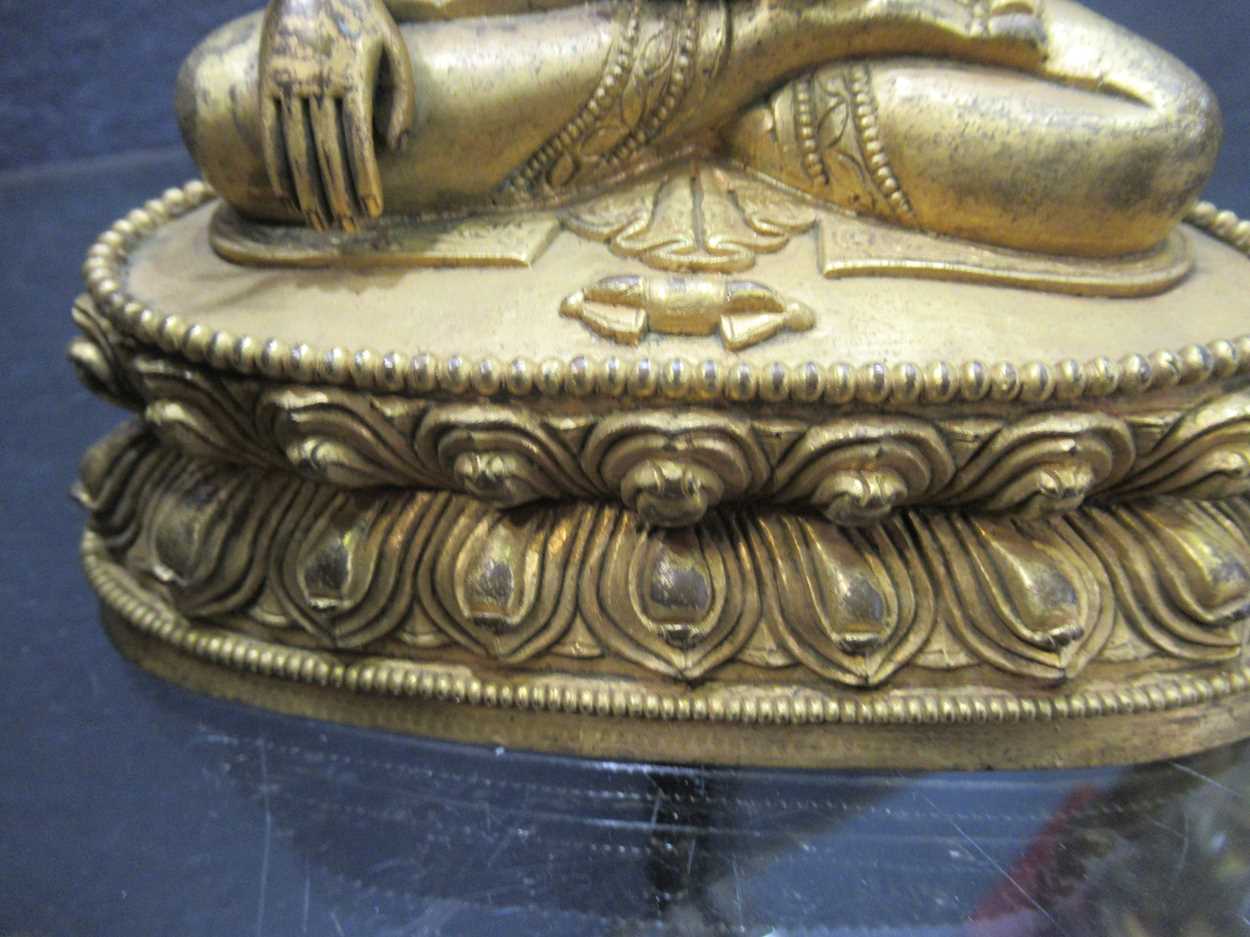 A Chinese gilt bronze figure of Buddha seated in meditation, - Image 7 of 13